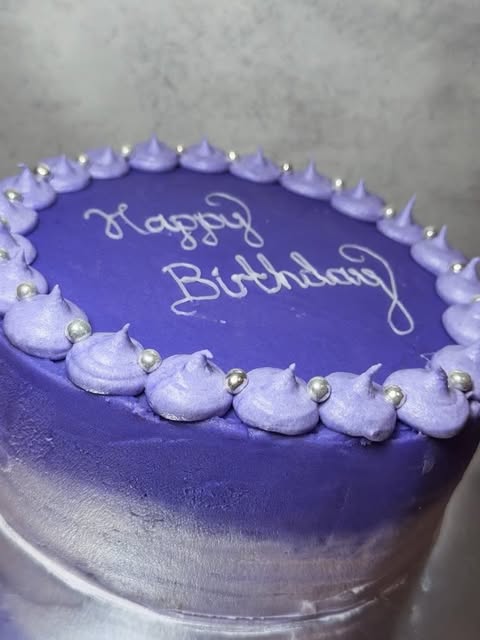 Purple birthday cake with silver pearls